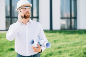 Man talking on phone during home inspection in San Antonio with A.I.M. Real Estate Inspections.